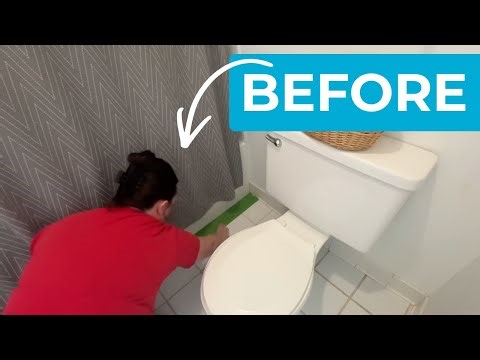 She tapes up her old bathroom floor for this GENIUS makeover idea!
