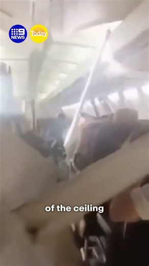 Plane's ceiling collapses in mid-air | 9 News Australia