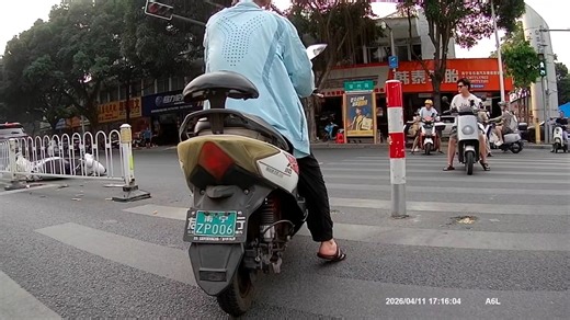 Car hits motorcycle at crosswalk in Nanning, China