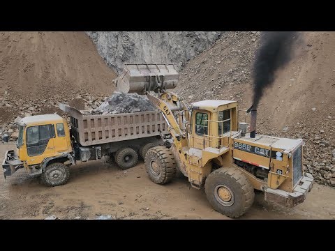 Caterpillar 966E Wheel Loader, A Symbol of Power, Precision & Strength: Loading Big Rocks