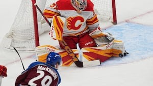 MacKinnon scores career-high 52nd goal of season, Avs clinch NHL's top seed with 3-1 win over Flames