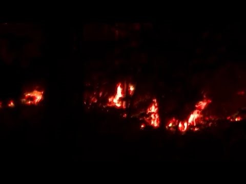 Fire crews fight blaze in wooded area of DeKalb County