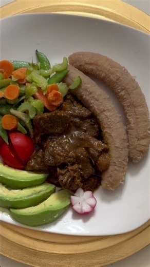 Curried goat, boiled green bananas w/avocado & mixed vegetables