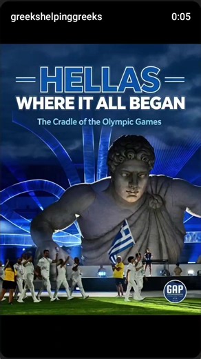 “ΕΛΛΑΔΑ — ΑΠ’ ΟΠΟΥ ΞΕΚΙΝΗΣΑΝ ΟΛΑ”🇬🇷 HELLAS — THE CRADLE OF THE OLYMPIC GAMES ✨This powerful shot captures the Hellenic Olympic Team marching in the Parade of Nations at an Olympic Opening Ceremony, beneath a monumental, towering statue of an ancient Greek athlete — a symbol of the timeless Greek origins of the Olympic spirit. The team proudly bears the Greek national flag, dressed in crisp white, with the iconic blue neon Olympic rings glowing in the background, honouring Greece’s eternal role