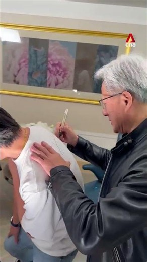 Nvidia founder Jensen Huang gives CNA cameraman a memento