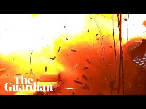 Huge explosion captured on CCTV after deadly strike hits grocery store in Kharkiv