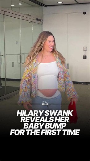 Pregnant Hilary Swank, 52, reveals her bump for the first time