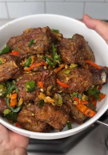 Skip the restaurant lines! These Salt and Pepper Spare Ribs are easy to make at home and deliver juicy, bold flavor. Golden and crunchy on the outside, super tender inside, tossed with crispy garlic, jalapeños, and that simple seasoning blend, they're the ultimate crowd-pleaser! Delicious as an appetizer or as a main dish with steamed rice. #saltandpepperspareribs #takeoutathome #asianfood #cookingrecipe #homecooking