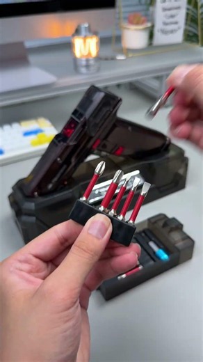 Small electric drill with swappable bits