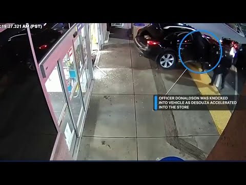 Shocking video shows moments officer is trapped in suspect’s car