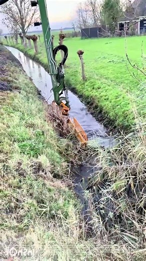Ditch Duty: The Bucket's Selective Sweep of a Waterway