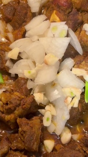Curried goat, boiled green bananas w/avocado & mixed vegetables