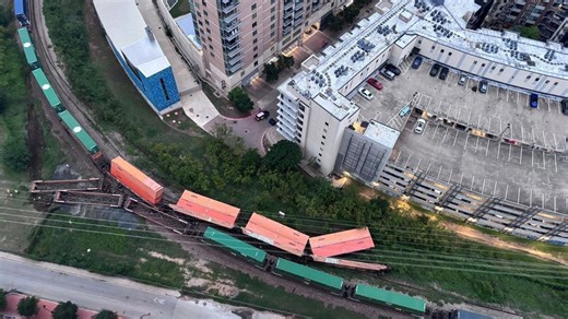 Cargo train derails in downtown Austin, causing road closures; no injuries reported