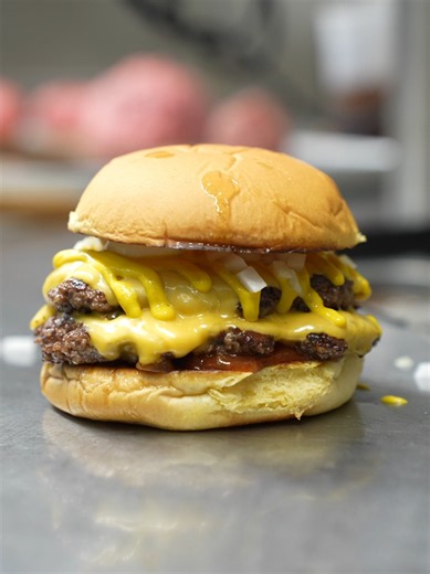 Bastion Burger in Calgary is known for their smash burgers, but the classic double is a fierce contender for the best thing on their menu. the red relish hits hard, it's so good.