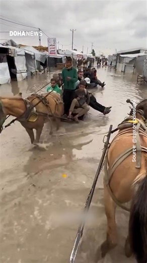 Flooding across Gaza worsens humanitarian crisis, displacing families. Heavy rains have submerged roads and tents, destroying belongings and turning fragile camps into muddy, unlivable conditions. | Doha News