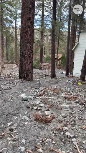 See homes, cars partially buried by mudslides in California
