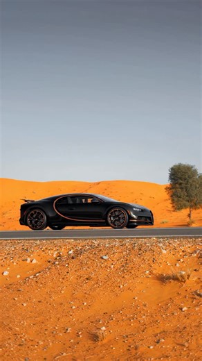 𝐁𝐮𝐠𝐚𝐭𝐭𝐢 𝐂𝐡𝐢𝐫𝐨𝐧 A final breath of engineering turned art. Glossy Nocturne Black with Copper Orange outside, Beluga Black and copper leather inside. The Final 1,500 HP Chiron—W16’s last song in motion. Not just a machine. A memory forged in metal, crafted by Bugatti. #Bugatti #Chiron #alainclassmotors | Al-Ain Class Motors