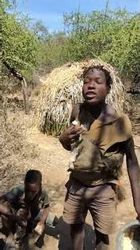 Hadzabe tribe bushmen always share beautiful moments in the nature together as family