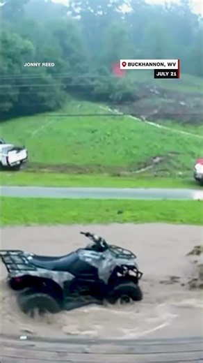 Shed, 4-wheeler and debris float past WV house as dad rushes son to safety