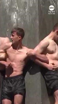 Naval Academy plebes scale the greased Herndon Monument