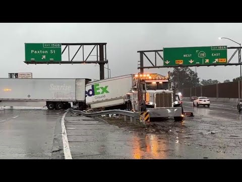 FedEx truck splits in half amid powerful storm