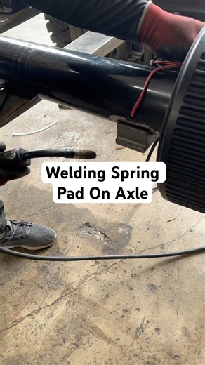 Welding spring pad on trailer axle