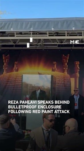 Reza Pahlavi delivers speech behind bulletproof enclosure