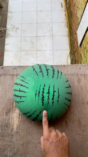 Experiment: Will this colored water balloon explode if dropped from a height?