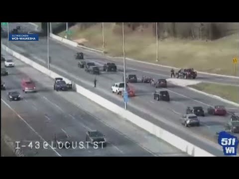 Watch: Law enforcement cruiser rolls over during pursuit on Milwaukee freeway