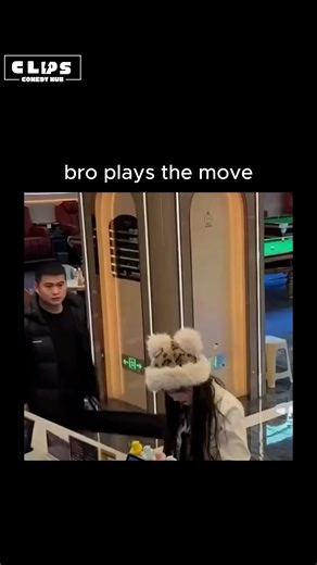 funny.hub.comedy on Instagram: "This post shares a viral prank video from a Chinese billiards venue, where a man slyly wears his female companion's fluffy ear hat, prompting her bewildered 15-second search around tables and chairs while he stands nearby unnoticed. - The clip, titled "The beautiful woman can't find her hat," has sparked light-hearted criticism for the prank's mild mischief, amassing 828 likes and 286 mostly Indonesian replies praising its humour with phrases like "so funny" and "