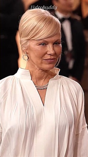 Pamela Anderson Stunning While Posing For Photographers At Event