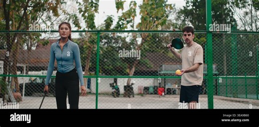 Mixed doubles couple playing pickleball together on an outdoor court Stock Video Footage - Alamy