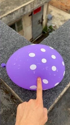 Experiment: Will a water balloon explode if it rolls down a tall building? 💥🎈 #balloon