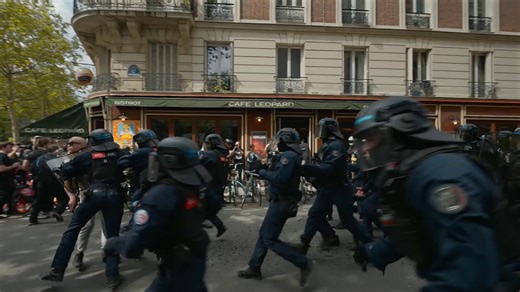 Riot police clash with protesters in Paris