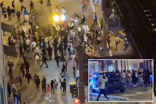 Scary moment hundreds of lawless teens run wild in spring break takeover of Chicago, forcing emergency curfew