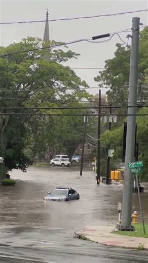 Floodwater sweeps through Connecticut town after heavy rain