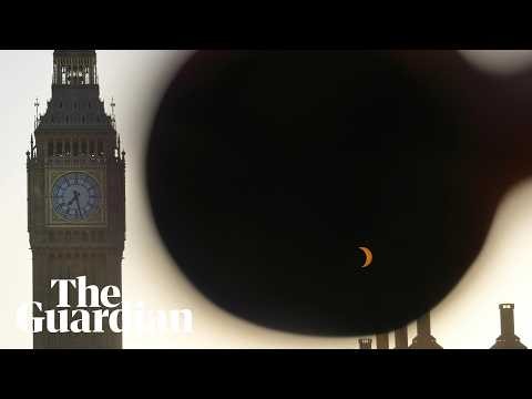 Solar eclipse visible over Houses of Parliament and Big Ben in London