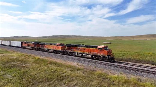 A trio of BNSF locomotives lead an eastbound heavy manifest with a DP tacked onto the tail as they begin their climb through the Sand Hills of Nebraska. #railroad #railway #train #fblifestyle #drone Antioch, NE - September 2025 | Craig Hensley Photography