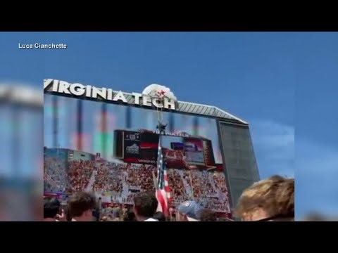 Skydiver slams into Virginia Tech scoreboard, dangles by parachute