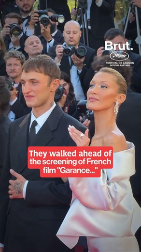 Bella Hadid walks hand in hand with her brother on the #cannes2026 red carpet.