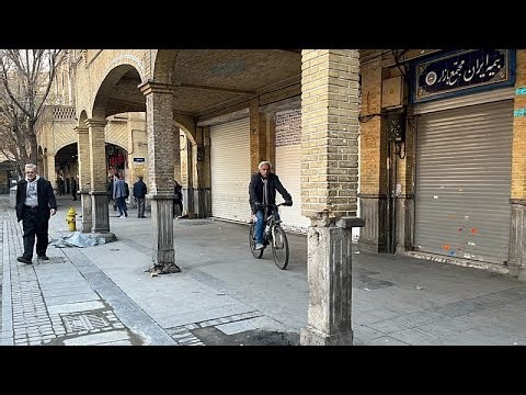 Security forces clash with protesters in Iran's main bazaar as 36 killed in rallies