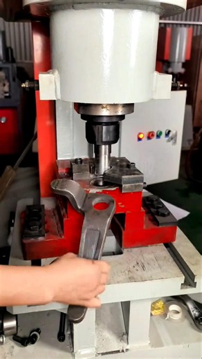 Heavy Hydraulic Press Punching Precision Holes In Steel Brackets