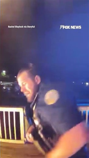 SEE IT: Hero cop kicks down door of burning building to rescue a family #shorts
