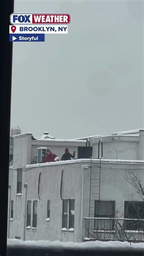 Rooftop Snowball Fight In Brooklyn, New York After Strong Winter Storm Dumps Snow On The Big Apple