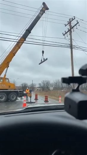 Crane Hits Power Lines, Ignites Fireball Windsor, Ontario — September 18, 2025 An ordinary construction lift turned into a fiery spectacle Thursday when a crane made contact with high-voltage power lines, triggering a massive explosion that was caught on camera. Onlookers filming from their car can be heard nervously commenting on the danger just moments before the incident. "That beam's getting real close to the wires," a man says. "They see it, right?" a woman replies anxiously. Their fears we