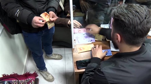 Syrians started swapping old banknotes for new ones under a plan to replace Assad-era money and strengthen the currency's value. | Reuters