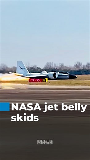 NASA’s WB-57 high-altitude research jet made a belly landing at Houston’s Ellington Airport after a mechanical failure prevented its landing gear from deploying, sliding down the runway on its underside with smoke and sparks visible. | Interesting Engineering