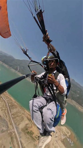 Paragliding in Tehri Dam Uttarakhand 💫 #skymagic #paraglidingrishikesh #reels #new #shortsfeed #fly