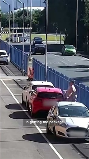 Man struggles to throw package of drugs over prison wall