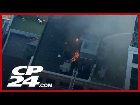 Crews knock down fire on roof of downtown Toronto building